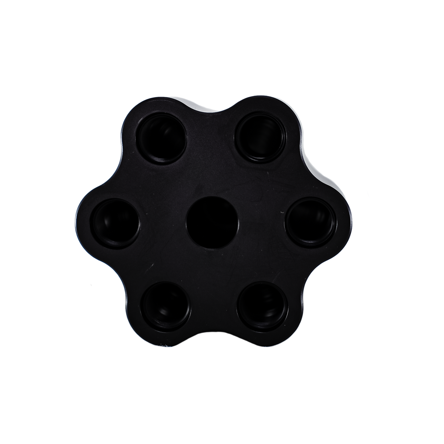 Black five-hole circular object on a white background