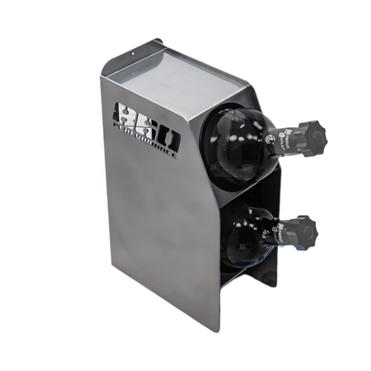 Metallic cylindrical device with two black knobs on a white background
