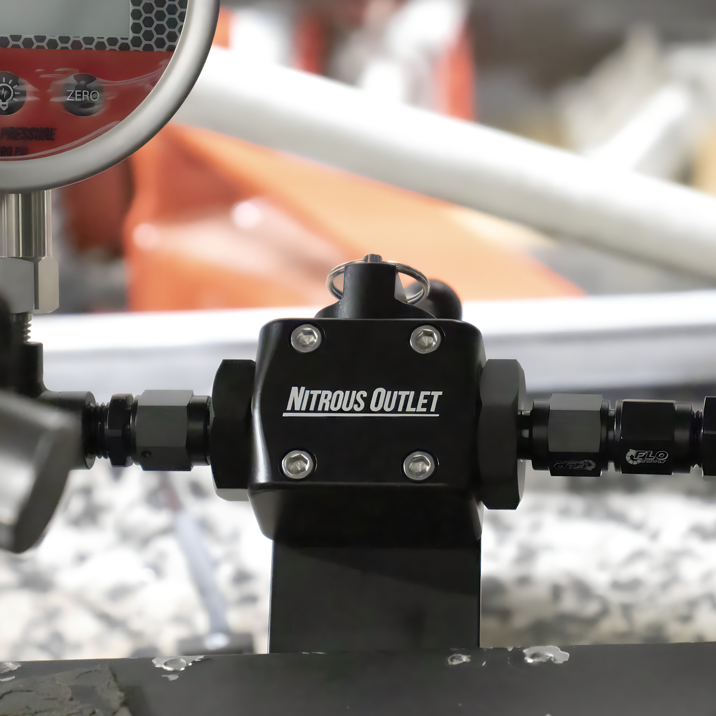 Nitrous outlet system on a vehicle with blurred background
