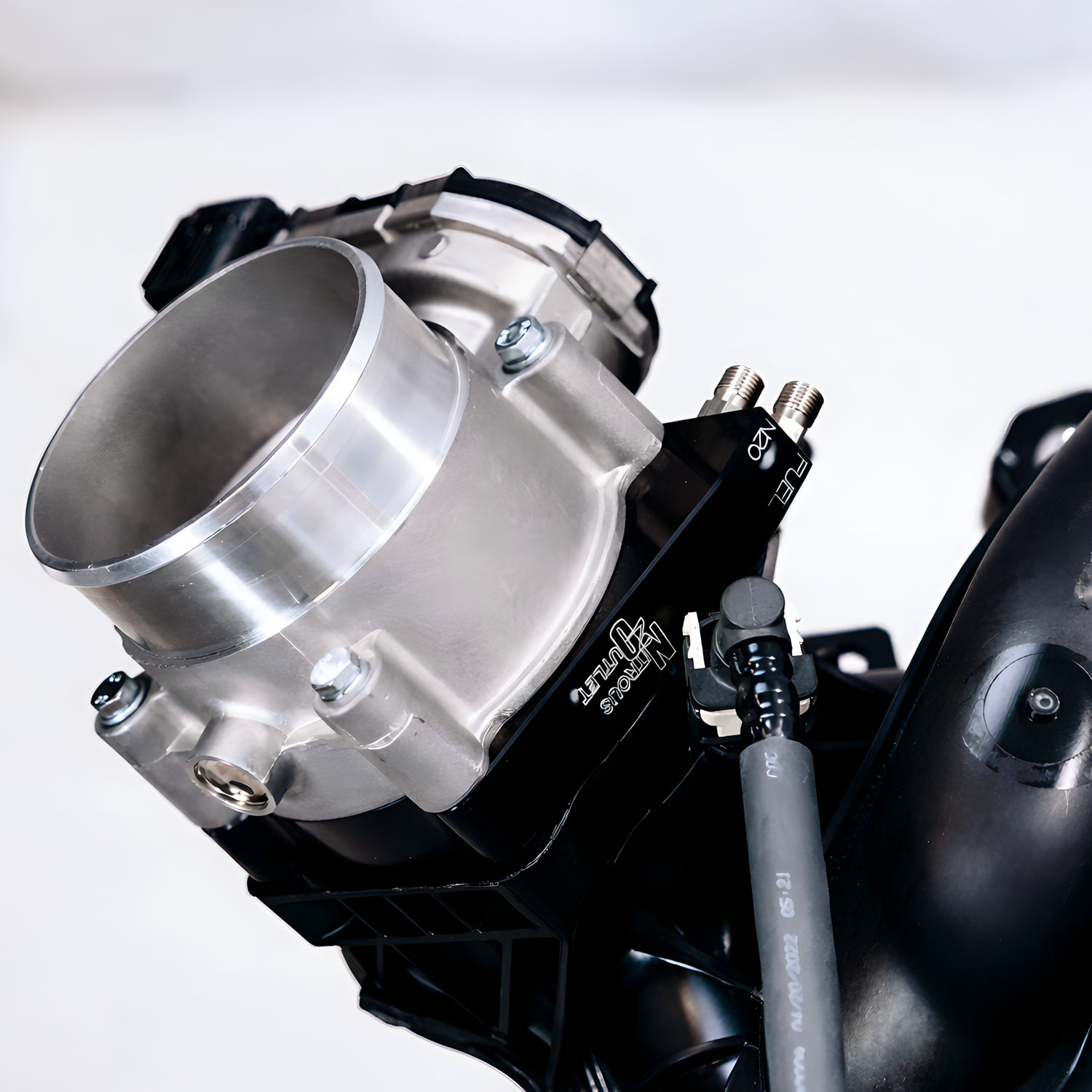 Close-up of a mechanical component with visible branding on a white background
