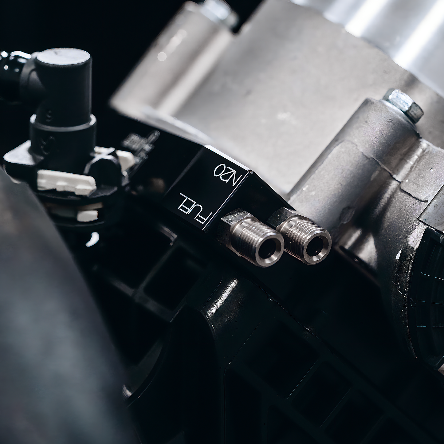 Close-up of a mechanical component with 'N20' branding on a dark background